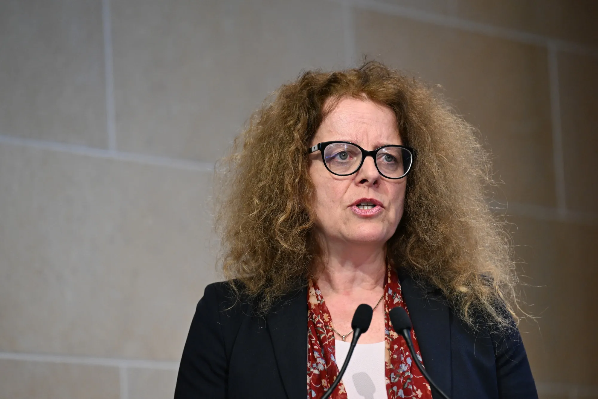 Isabel Schnabel is speaking at a podium during a presentation or announcement related to the digital euro.